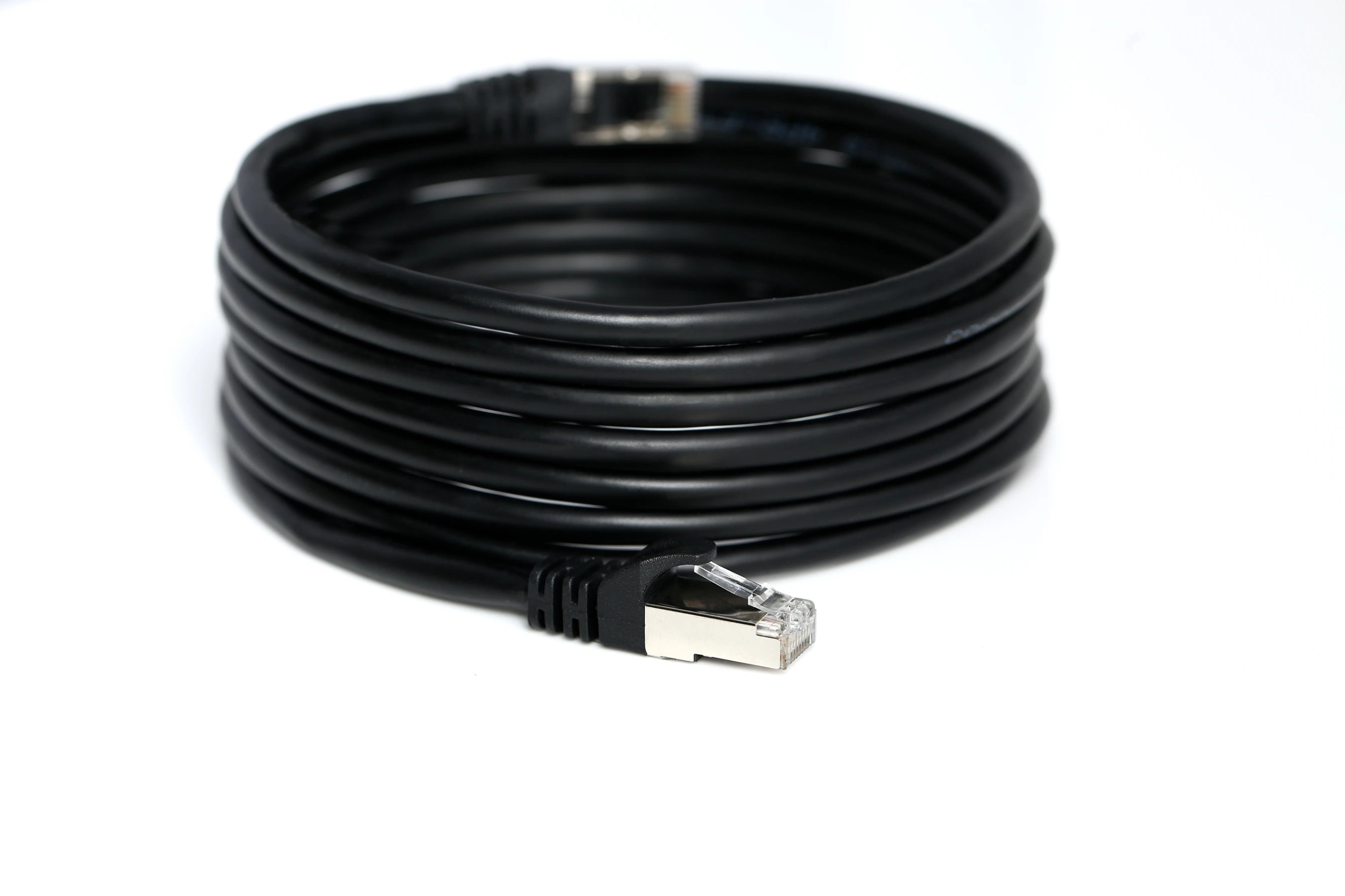 Coiled Cat6 Ethernet cables arranged in a pile