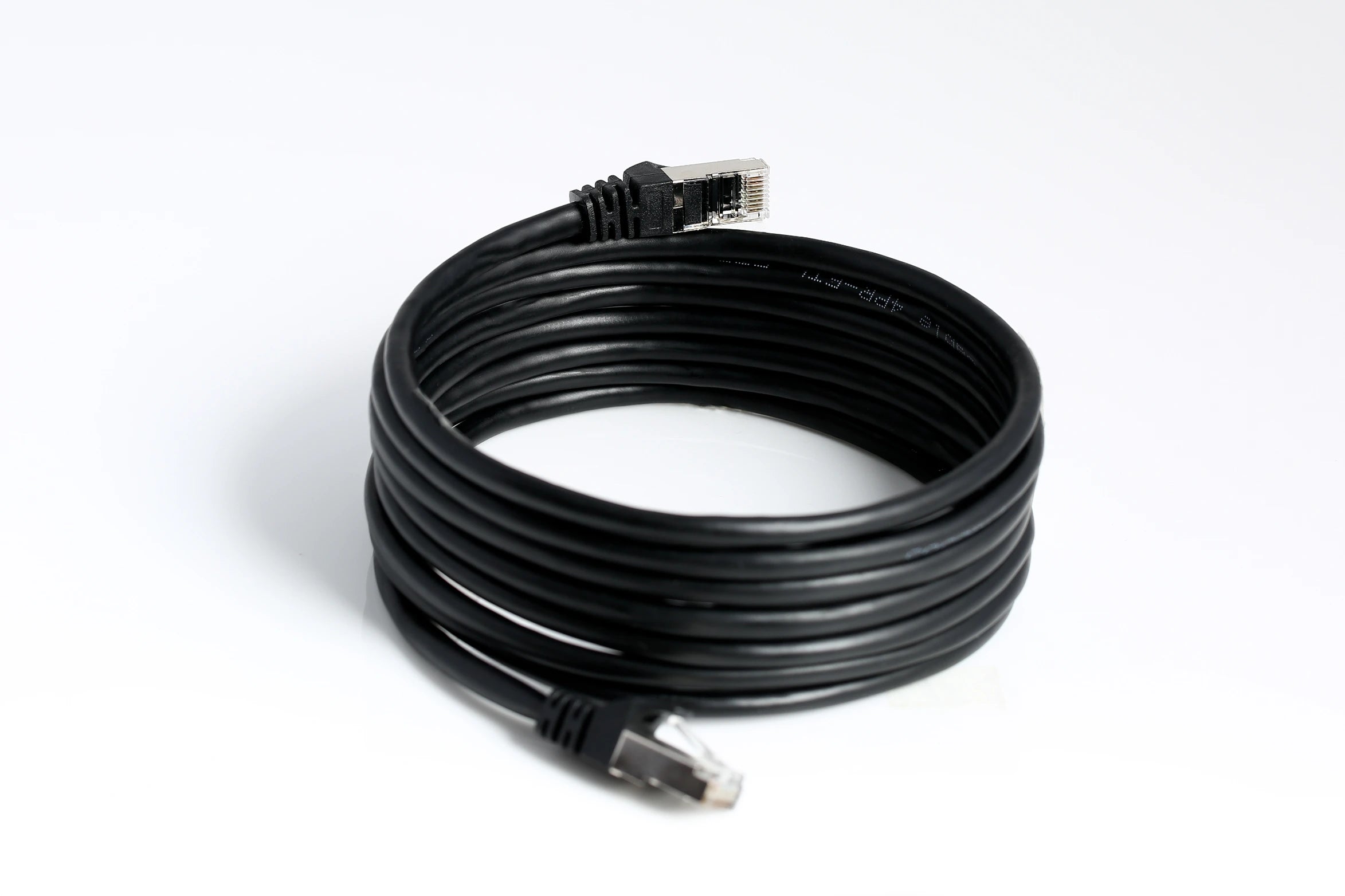 Coiled Cat6 Ethernet cables arranged in a pile