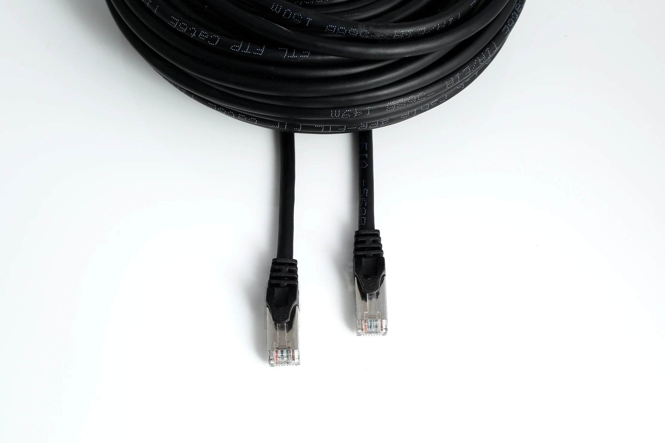 Coiled Cat6 Ethernet cables arranged in a pile