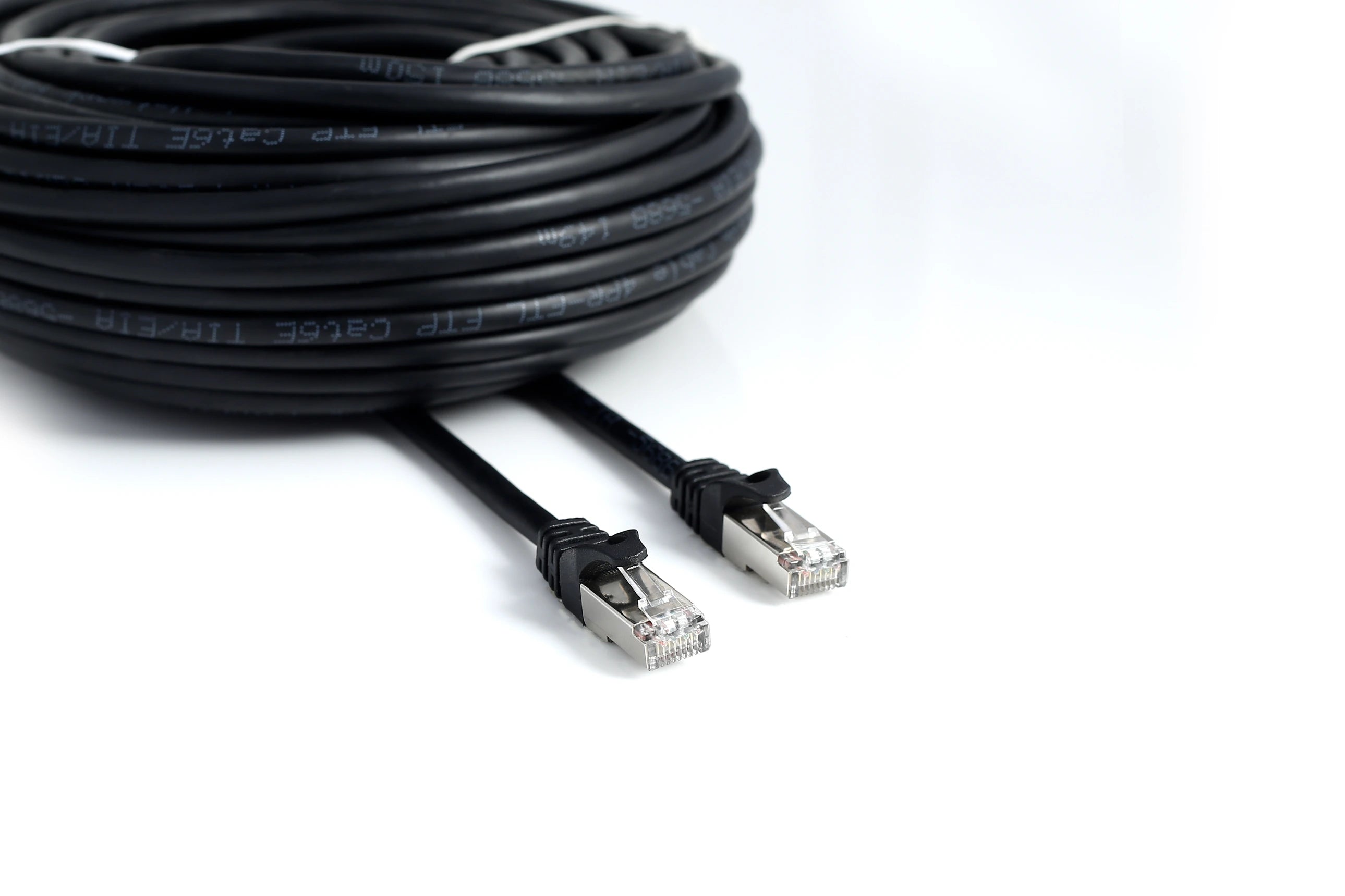 Coiled Cat6 Ethernet cables arranged in a pile