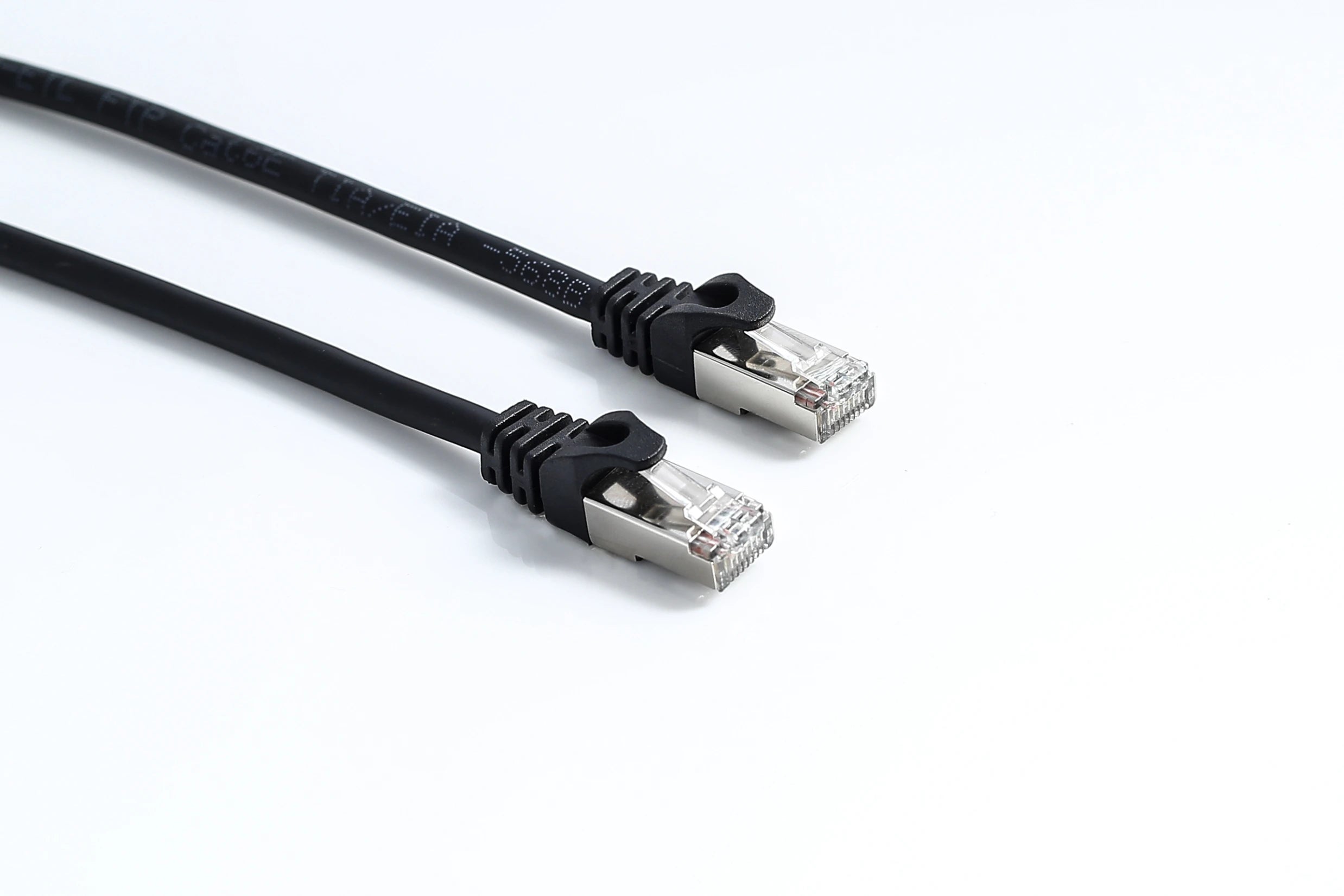 Coiled Cat6 Ethernet cables arranged in a pile