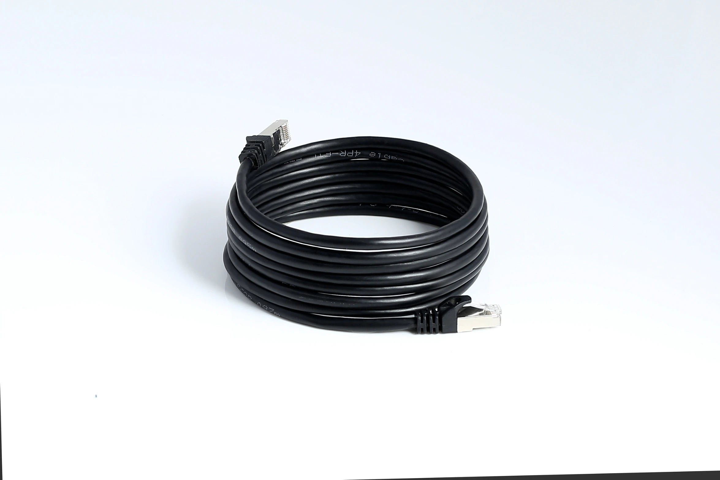 Coiled Cat6 Ethernet cables arranged in a pile